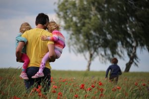 family in poppy field