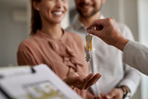 giving keys to couple