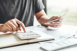 man working out divorce finances