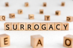 Surrogacy - word from wooden blocks with letters
