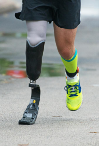 man running with prosthetic leg