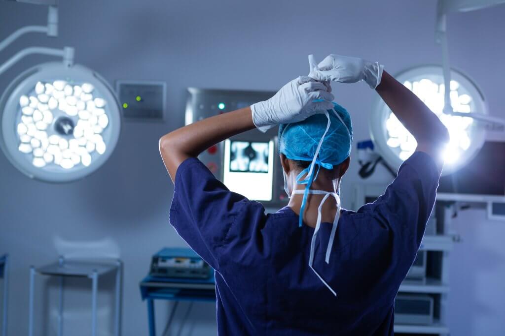 Female surgeon wearing surgical mask