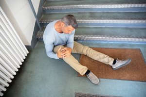 Mature Man Sitting On Staircase