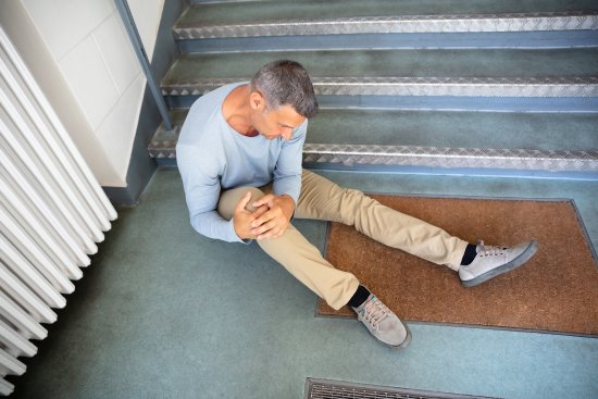 Mature Man Sitting On Staircase