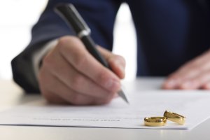 husband signing decree of divorce