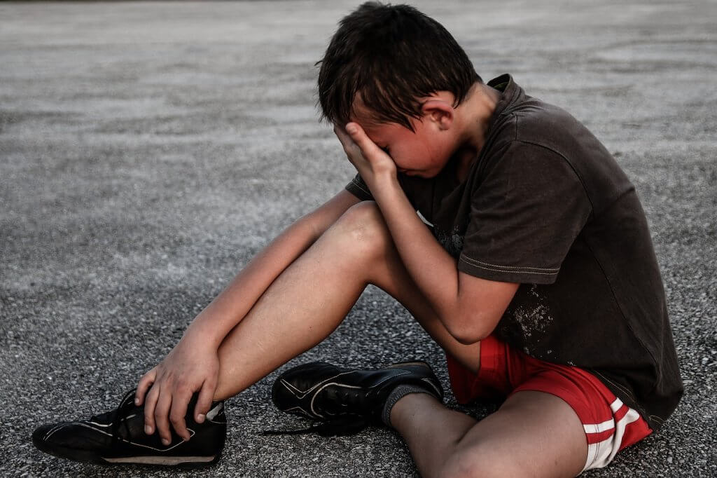 boy crying after accident